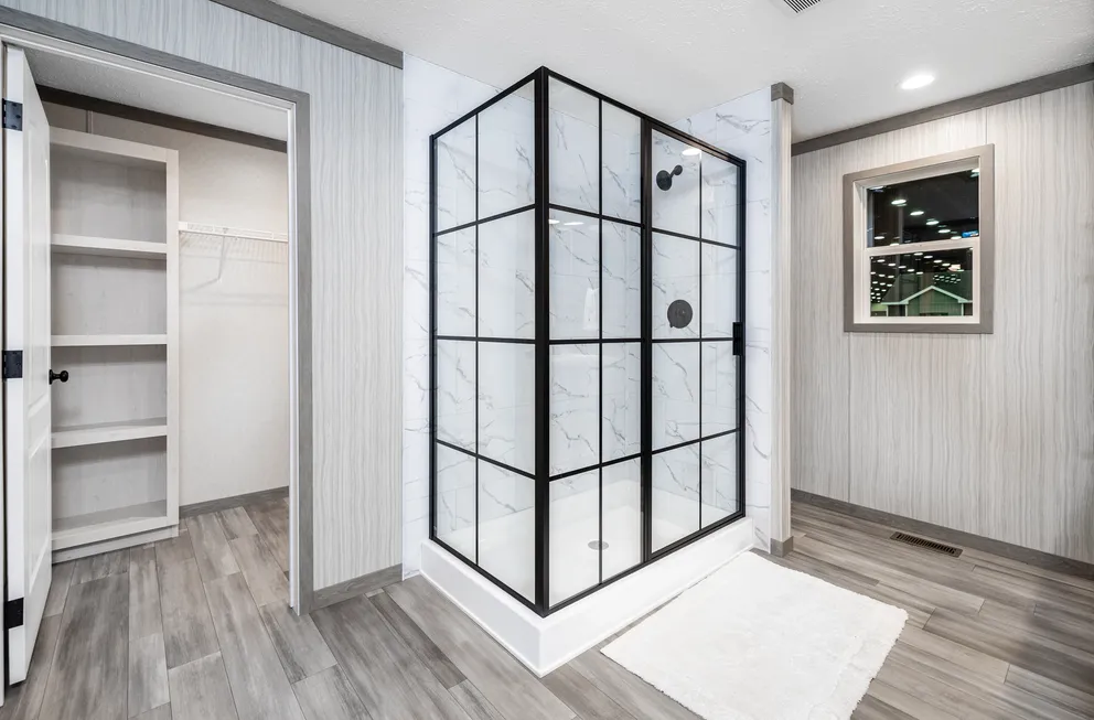 The 6428-E792 THE PULSE Primary Bathroom. This Manufactured Mobile Home features 3 bedrooms and 2.5 baths.