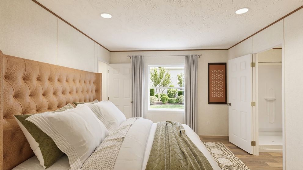The ASPEN Primary Bedroom. This Manufactured Mobile Home features 3 bedrooms and 2 baths.