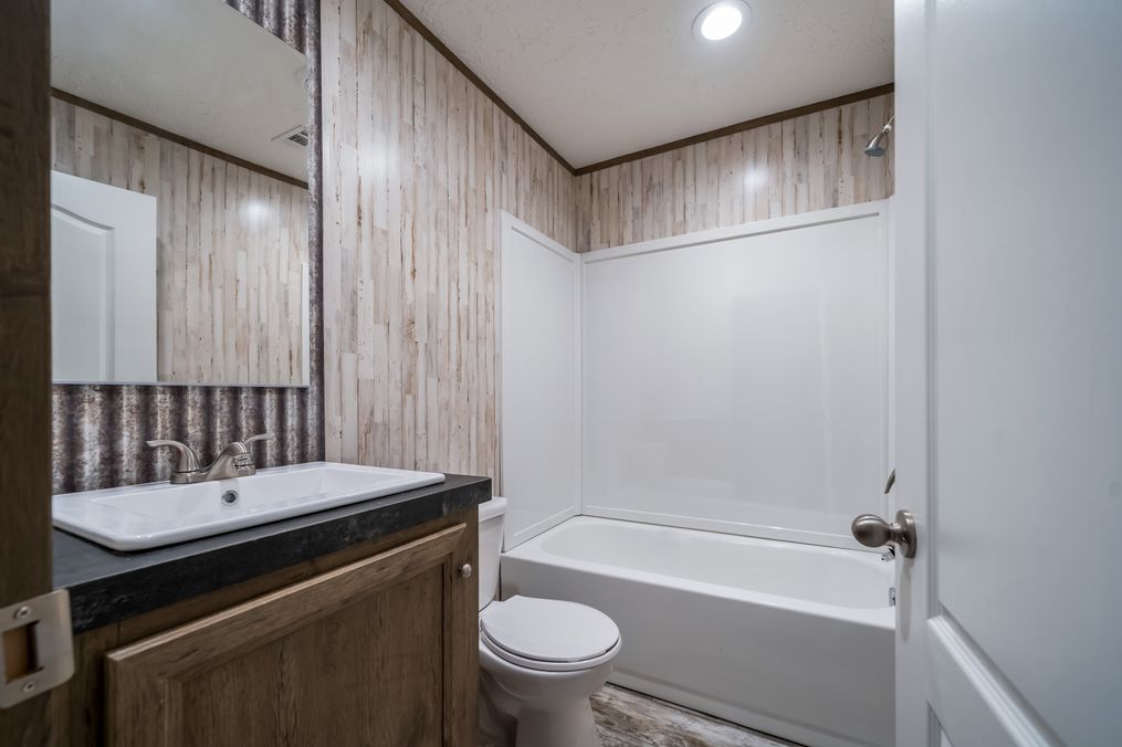 The ANNIVERSARY SPLASH Guest Bathroom. This Manufactured Mobile Home features 3 bedrooms and 2 baths.