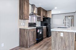 The ANNIVERSARY 16763S Kitchen. This Manufactured Mobile Home features 3 bedrooms and 2 baths.