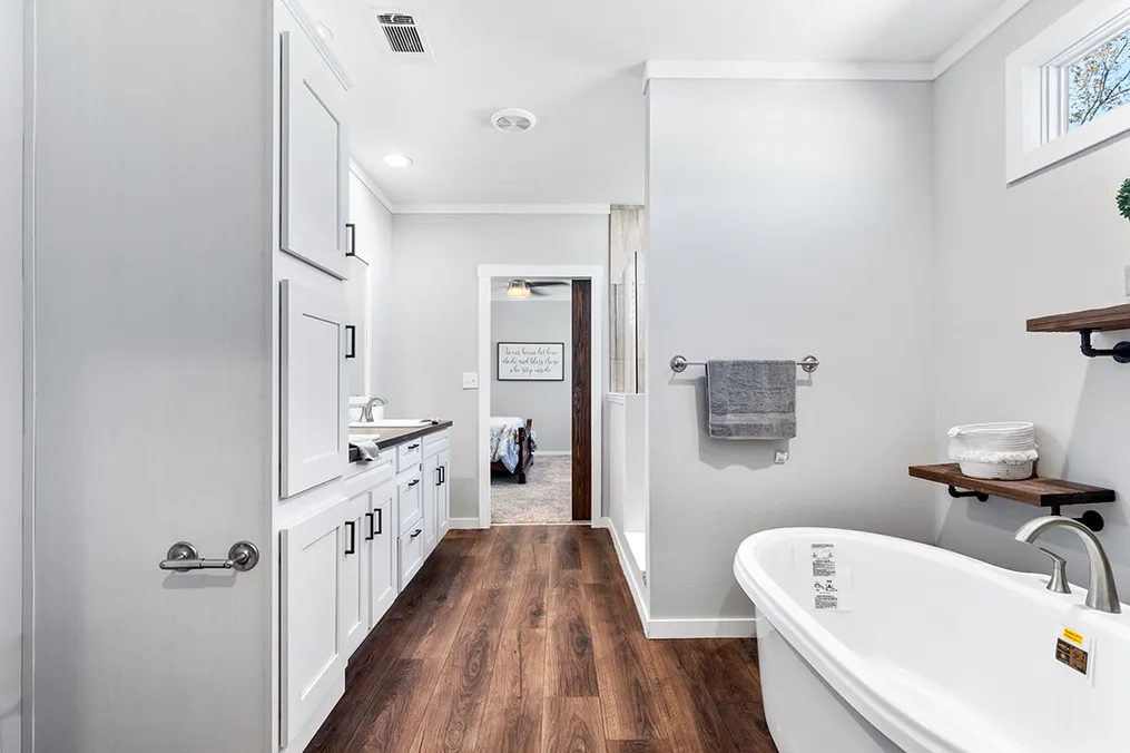 The THE VAIL Primary Bathroom. This Manufactured Mobile Home features 3 bedrooms and 2 baths.