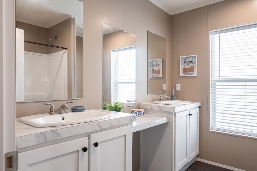 The ISLAND BREEZE 64 Guest Bathroom. This Manufactured Mobile Home features 4 bedrooms and 2 baths.