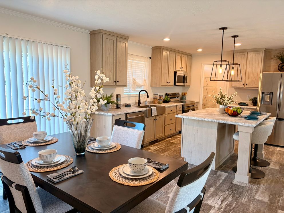 The TOURMALINE 7628-649 Dining Area. This Manufactured Mobile Home features 4 bedrooms and 2 baths.