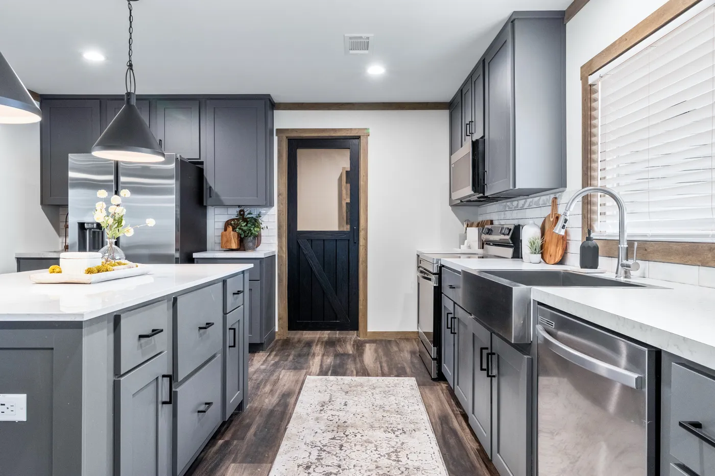 The EVERETT ELITE Kitchen. This Manufactured Mobile Home features 4 bedrooms and 3 baths.