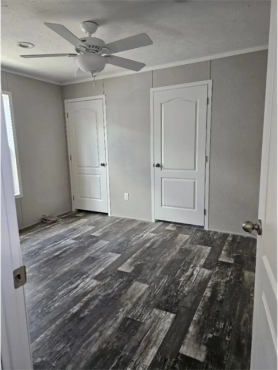 The TOPAZ Primary Bedroom. This Manufactured Mobile Home features 3 bedrooms and 2 baths.