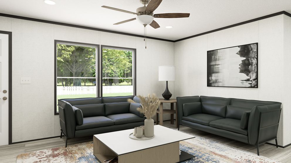 The THE MOUNTAINEER 56 Living Room. This Manufactured Mobile Home features 3 bedrooms and 2 baths.