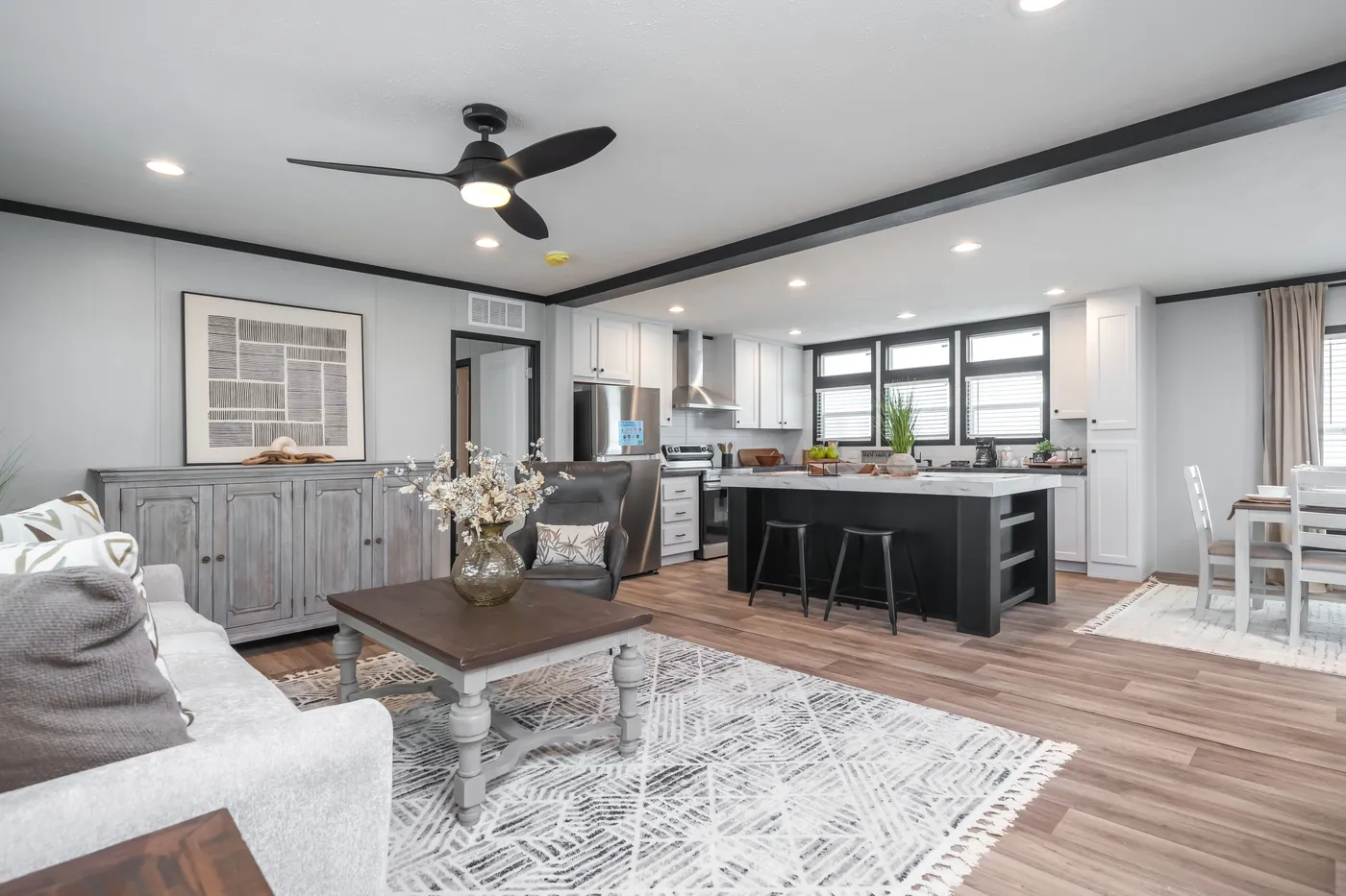 The ABSOLUTE VALUE Living Room. This Manufactured Mobile Home features 4 bedrooms and 2 baths.