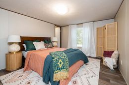 The CELEBRATION Primary Bedroom. This Manufactured Mobile Home features 3 bedrooms and 2 baths.