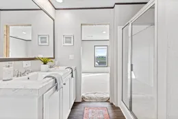 The THE REAL DEAL Primary Bathroom. This Manufactured Mobile Home features 3 bedrooms and 2 baths.
