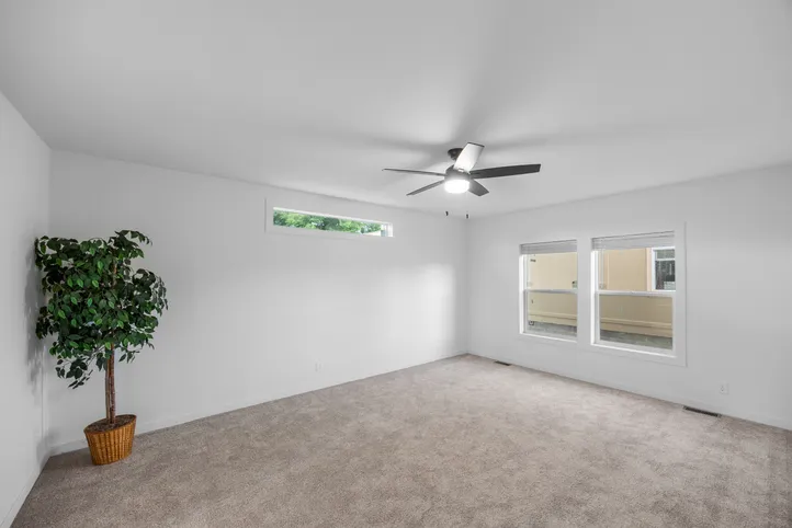 The LULAMAE 3 Primary Bedroom. This Manufactured Mobile Home features 3 bedrooms and 2 baths.