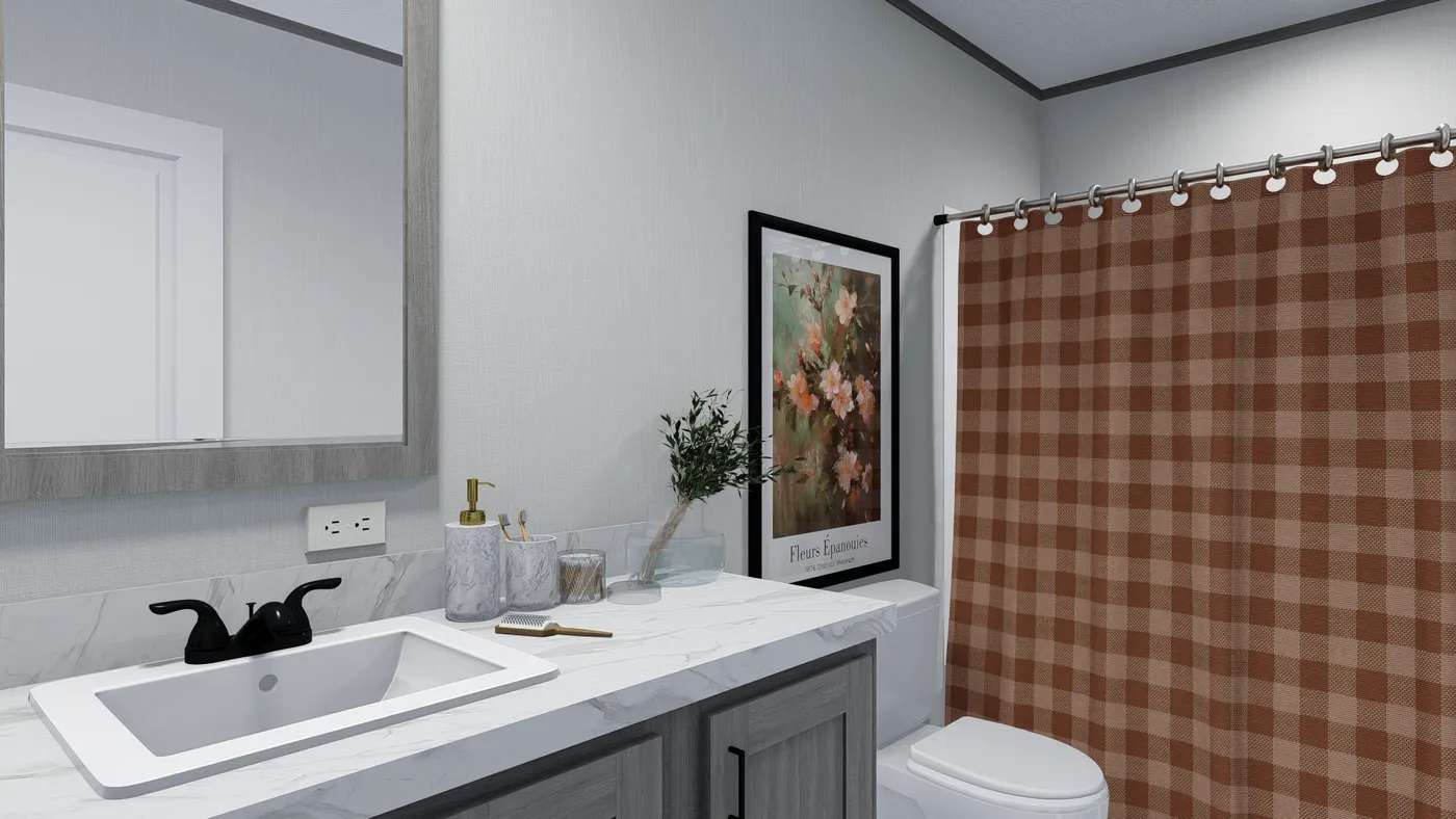 The DIAMOND Guest Bathroom. This Manufactured Mobile Home features 3 bedrooms and 2 baths.