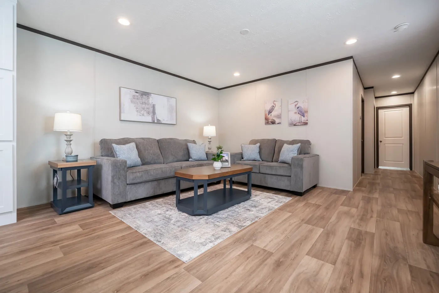 The DYNAMIC Living Room. This Manufactured Mobile Home features 3 bedrooms and 2 baths.