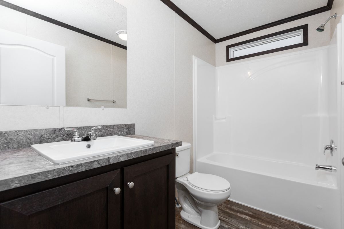 The 4828-746 THE PULSE Primary Bathroom. This Manufactured Mobile Home features 3 bedrooms and 2 baths.