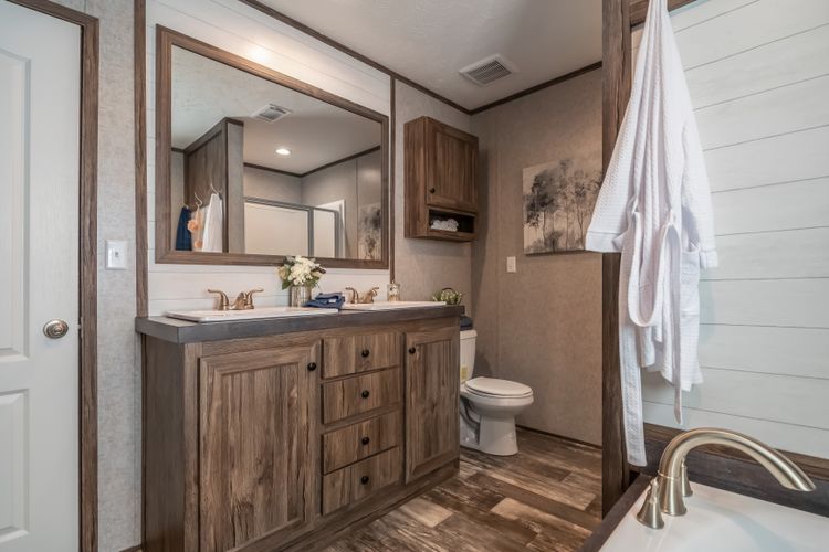 The LIBERTY Primary Bathroom. This Manufactured Mobile Home features 3 bedrooms and 2 baths.