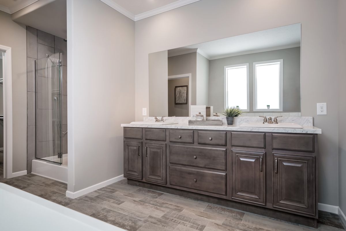 The HUXTON II Master Bathroom. This Manufactured Mobile Home features 4 bedrooms and 2 baths.
