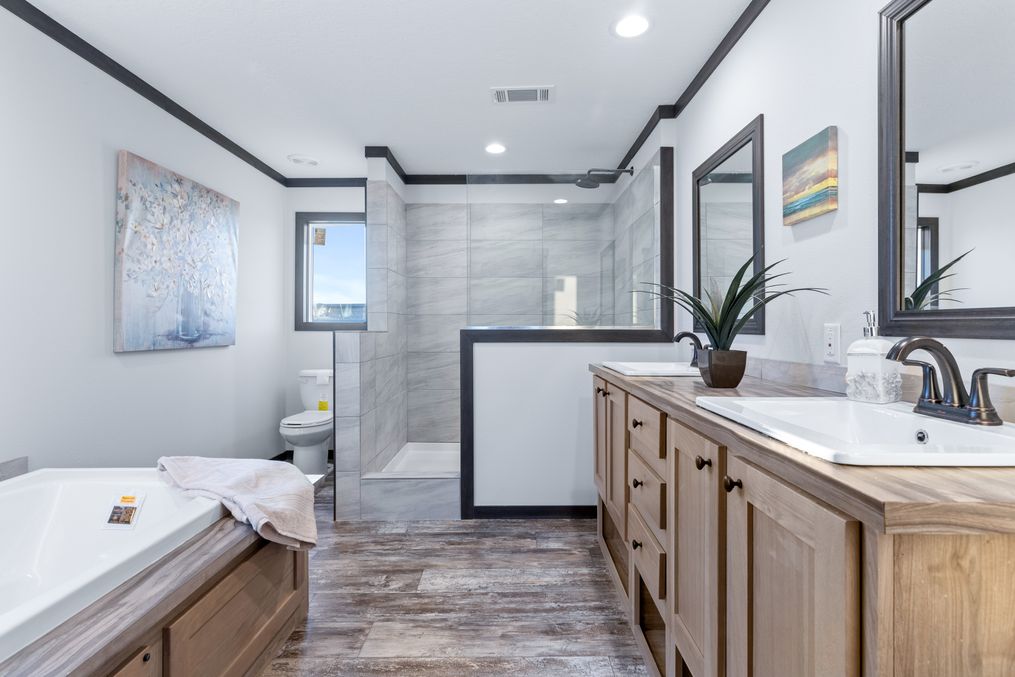 The BOUJEE XL Primary Bathroom. This Manufactured Mobile Home features 4 bedrooms and 3 baths.