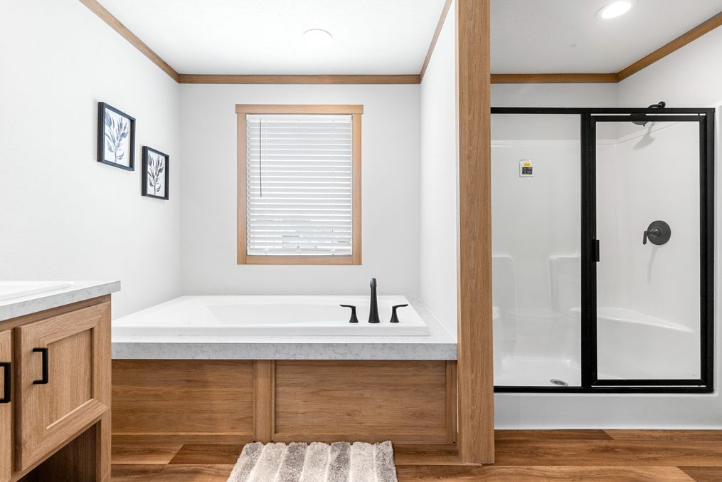 The HARPER Primary Bathroom. This Manufactured Mobile Home features 3 bedrooms and 2 baths.