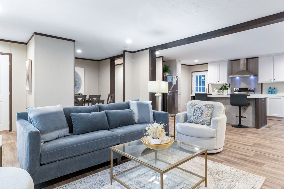 The THE DISCOVER Family Room. This Manufactured Mobile Home features 3 bedrooms and 2 baths.