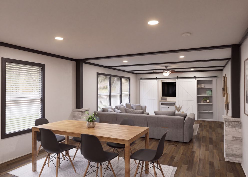 The THE FUSION 32H Dining Area. This Manufactured Mobile Home features 5 bedrooms and 3 baths.