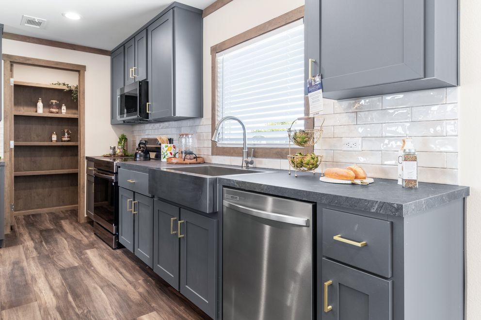 The FARM 4 FLEX Kitchen. This Manufactured Mobile Home features 4 bedrooms and 3 baths.