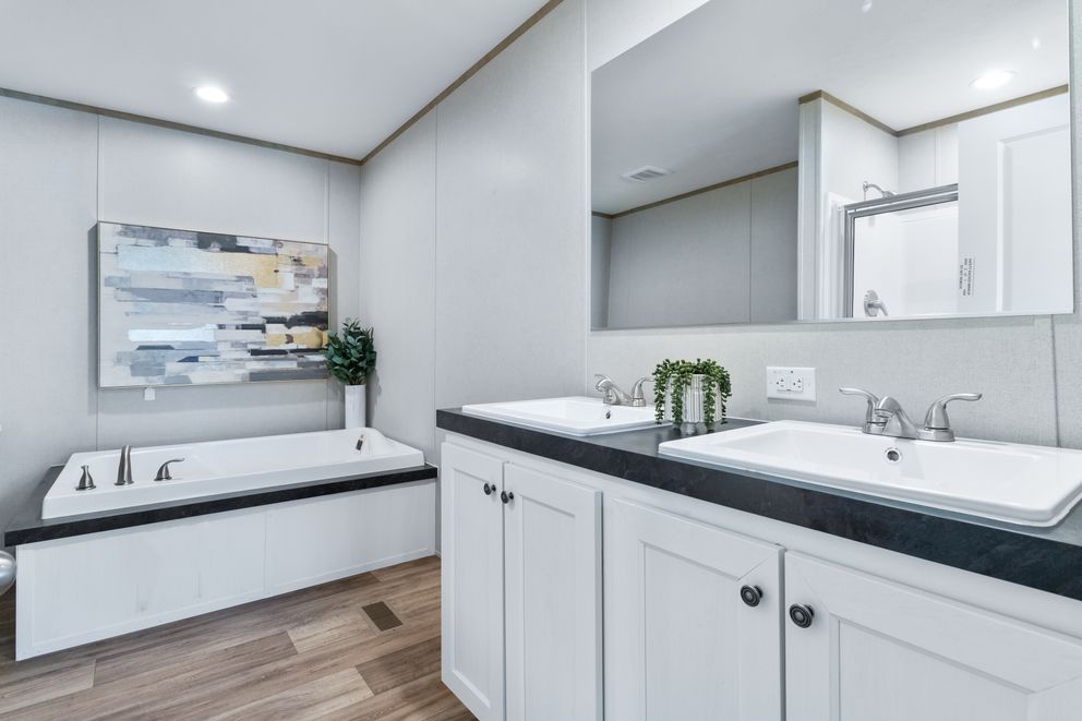 The ASPIRE Primary Bathroom. This Manufactured Mobile Home features 3 bedrooms and 2 baths.