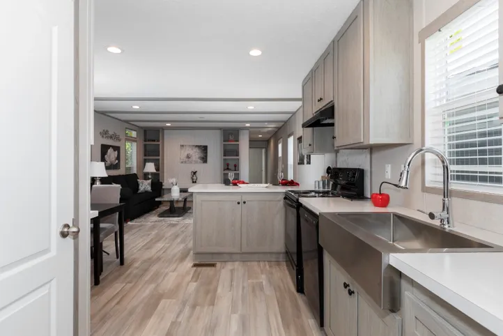 The THE ANNIVERSARY 76 Kitchen. This Manufactured Mobile Home features 3 bedrooms and 2 baths.
