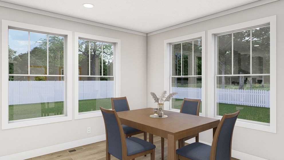 The WHOLE LOTTA LOVE Dining Area. This Manufactured Mobile Home features 3 bedrooms and 2 baths.