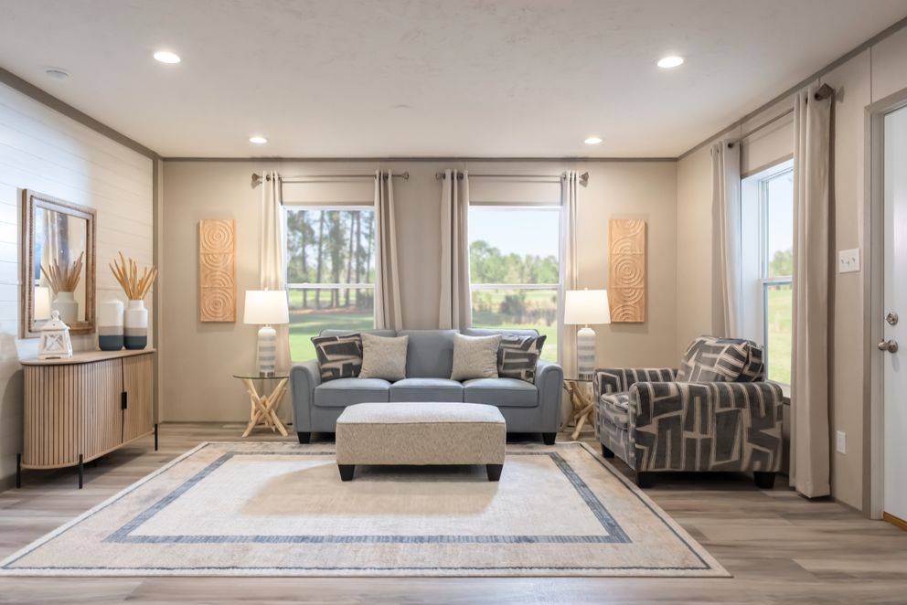 The TRADITION 48F Living Room. This Manufactured Mobile Home features 3 bedrooms and 2 baths.