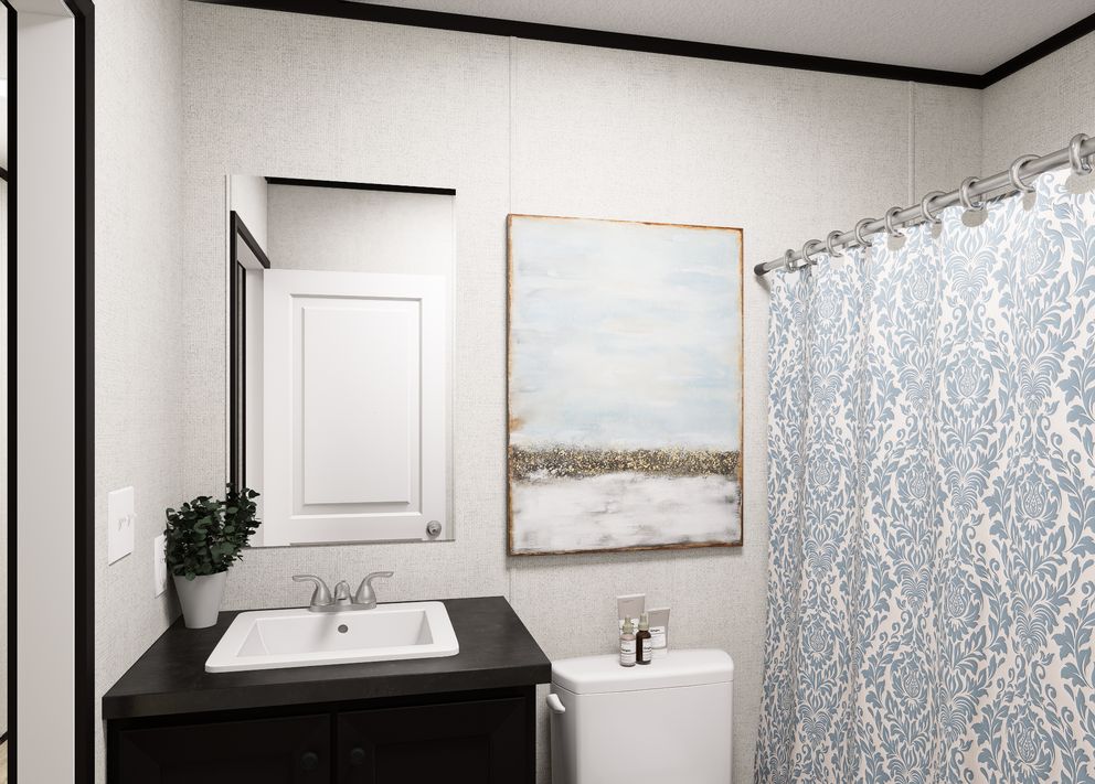 The NORTHSTAR Guest Bathroom. This Manufactured Mobile Home features 3 bedrooms and 2 baths.