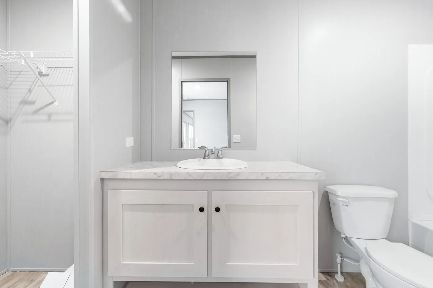 The BREEZE 16602A Primary Bathroom. This Manufactured Mobile Home features 2 bedrooms and 2 baths.