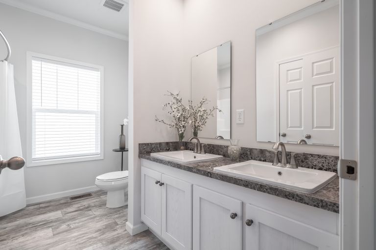The 4872 ENTERPRISE 32X76 HUD Guest Bathroom. This Manufactured Mobile Home features 4 bedrooms and 2 baths.