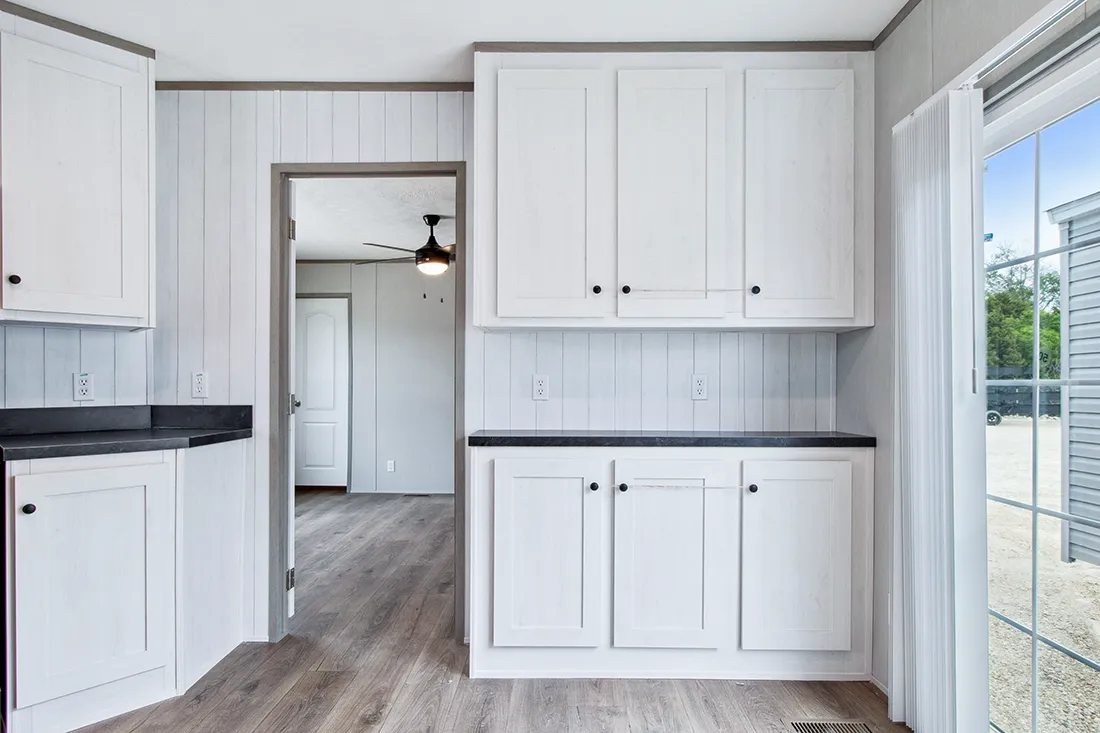 The ANNIVERSARY 16682F Dining Area. This Manufactured Mobile Home features 2 bedrooms and 2 baths.