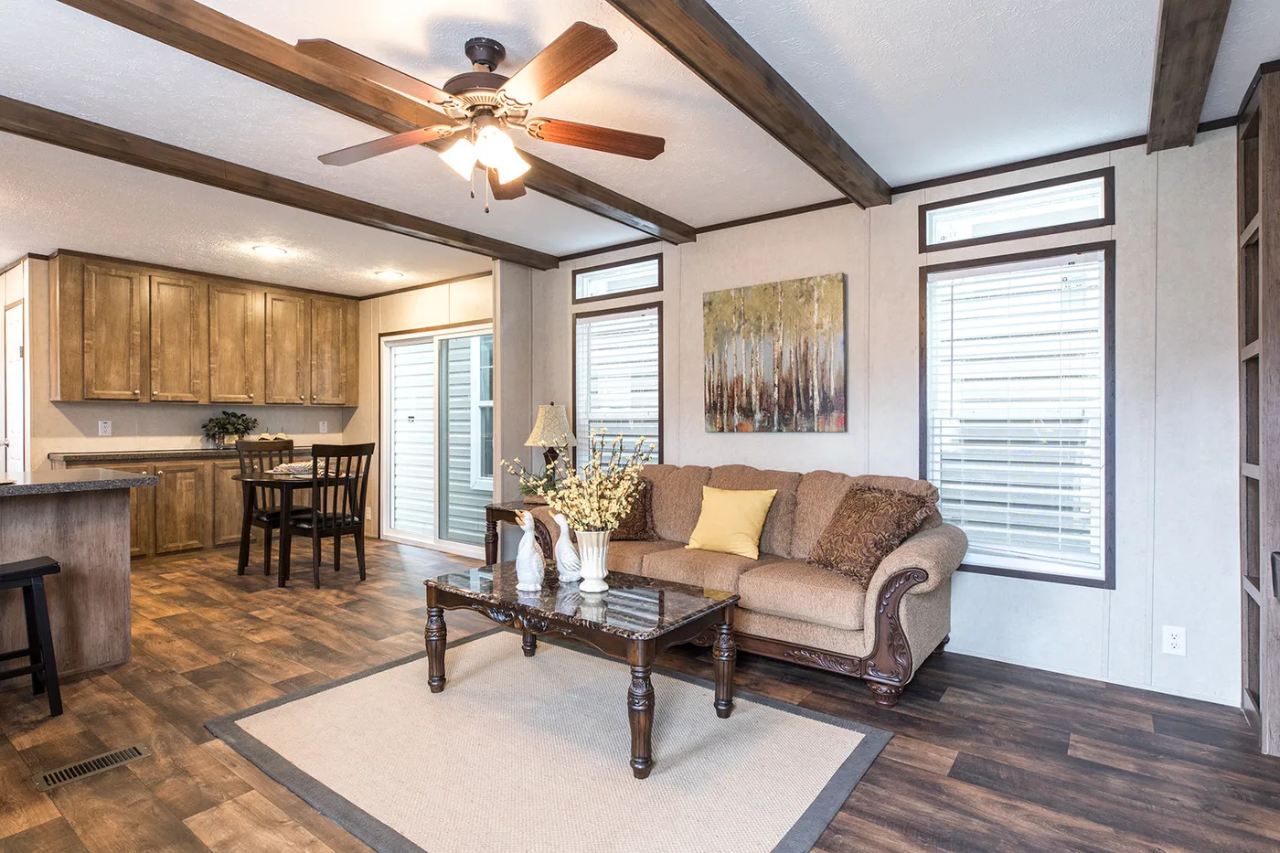 The THE ANNIVERSARY Living Room. This Manufactured Mobile Home features 3 bedrooms and 2 baths.