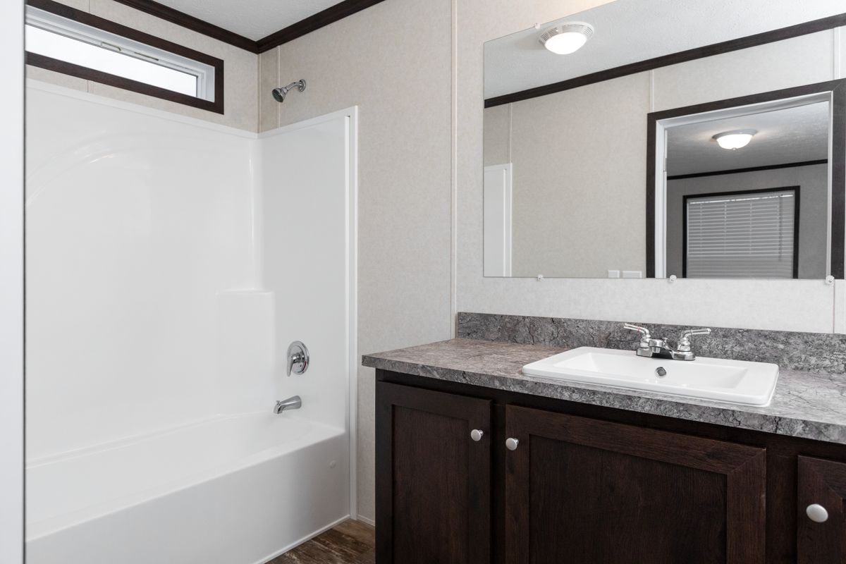 The 4828-746 THE PULSE Primary Bathroom. This Manufactured Mobile Home features 3 bedrooms and 2 baths.