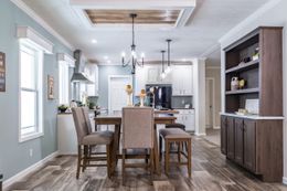 The CLASSIC 56D Dining Area. This Manufactured Mobile Home features 3 bedrooms and 2 baths.