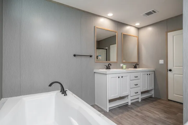 The BLUEBONNET BREEZE Primary Bathroom. This Manufactured Mobile Home features 3 bedrooms and 2 baths.