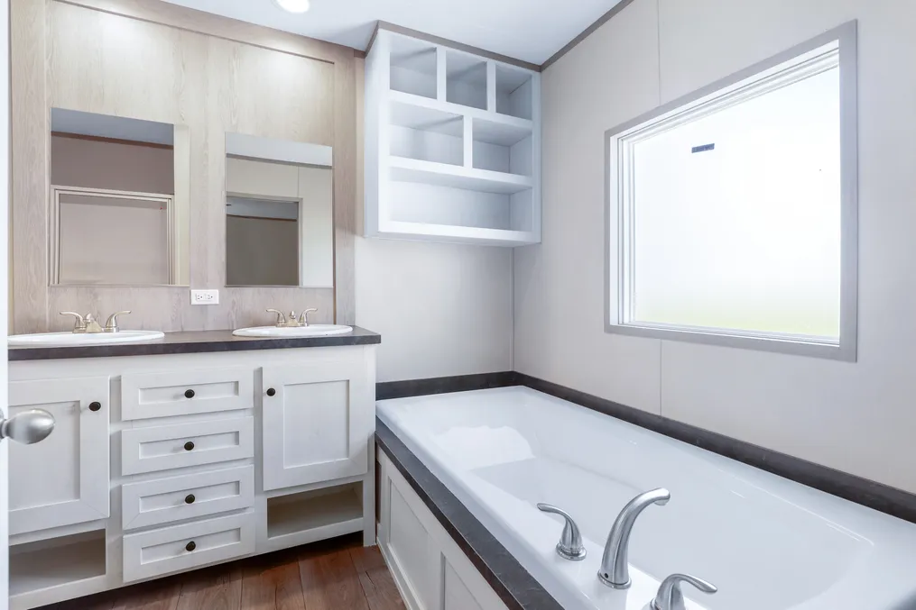 The ANNIVERSARY 16602A Primary Bathroom. This Manufactured Mobile Home features 2 bedrooms and 2 baths.