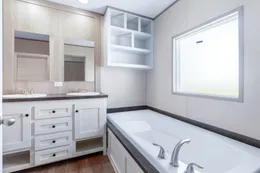 The ANNIVERSARY 16602A Primary Bathroom. This Manufactured Mobile Home features 2 bedrooms and 2 baths.