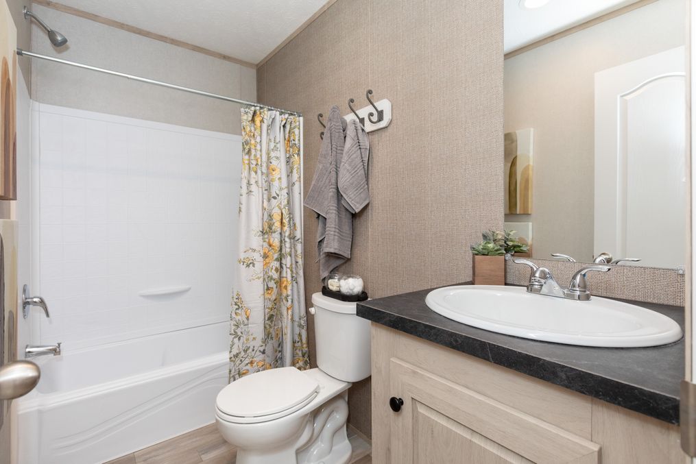 The MAYNARDVILLE CLASSIC 66 Guest Bathroom. This Manufactured Mobile Home features 3 bedrooms and 2 baths.