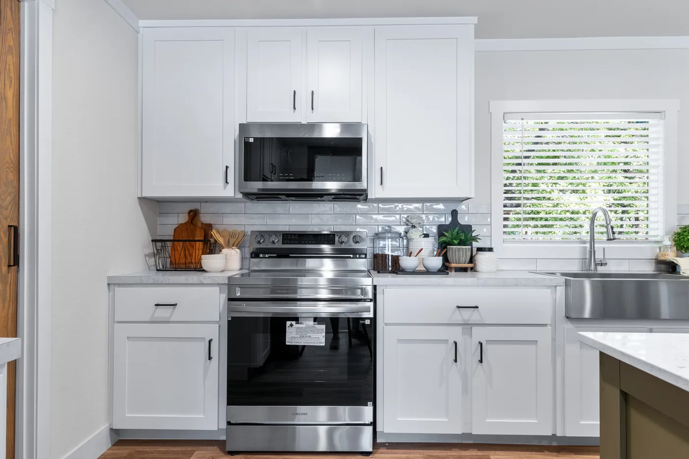 The FARM 4 FLEX ELITE Kitchen. This Manufactured Mobile Home features 4 bedrooms and 3 baths.