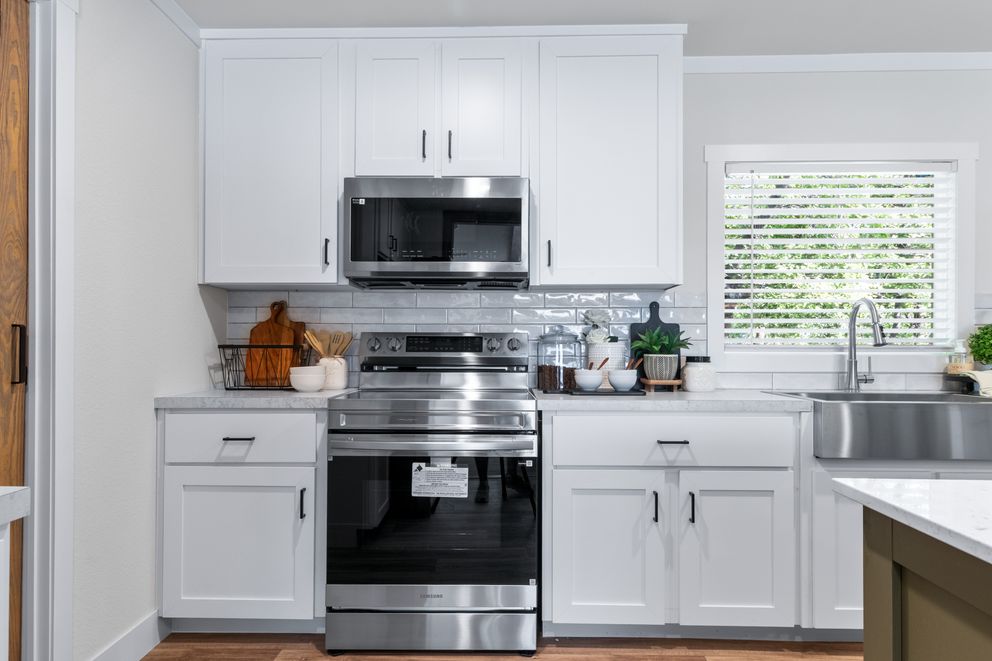 The FARM 4 FLEX ELITE Kitchen. This Manufactured Mobile Home features 4 bedrooms and 3 baths.