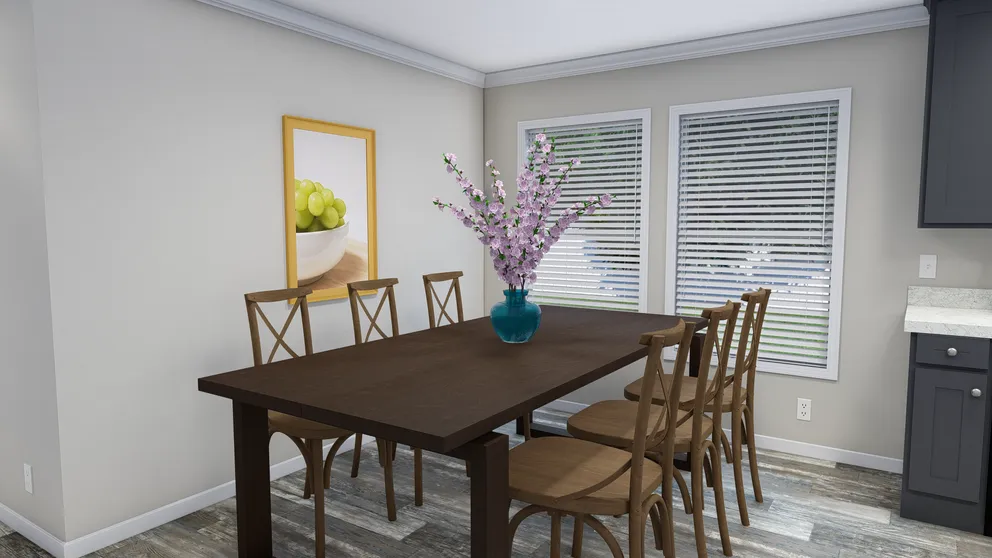 The CAROLINIAN M5000 Dining Area. This Manufactured Mobile Home features 3 bedrooms and 2 baths.