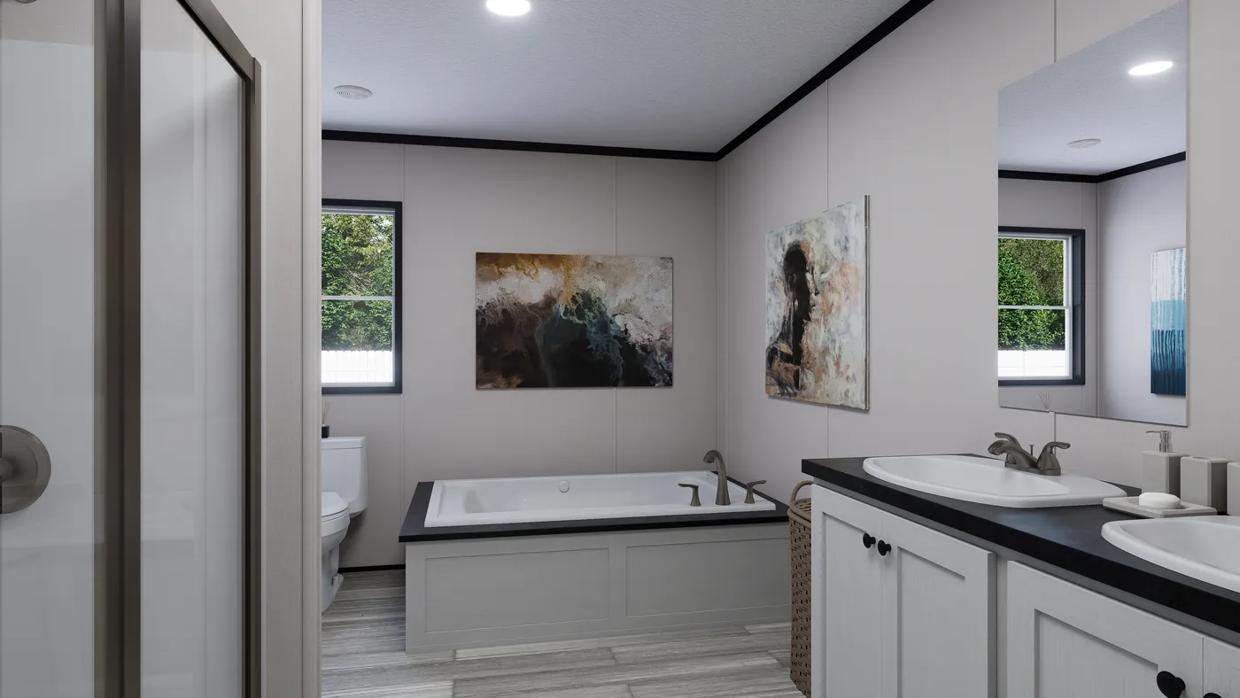 The THE MOUNTAINEER 56 Primary Bathroom. This Manufactured Mobile Home features 3 bedrooms and 2 baths.