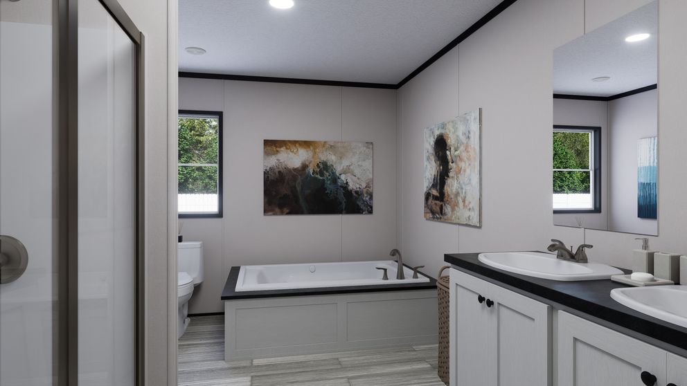 The THE MOUNTAINEER 56 Primary Bathroom. This Manufactured Mobile Home features 3 bedrooms and 2 baths.