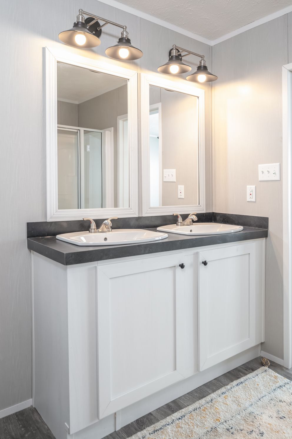 The TRADITION 48 Primary Bathroom. This Manufactured Mobile Home features 3 bedrooms and 2 baths.