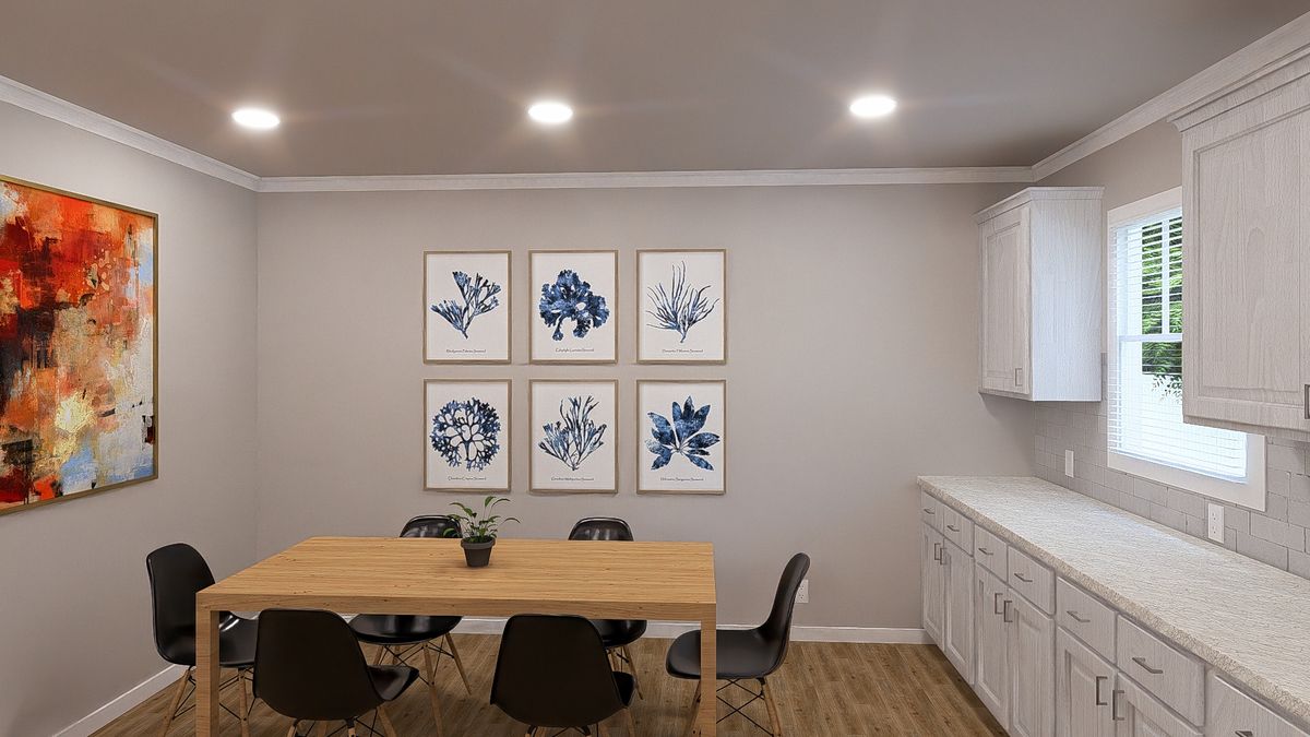 The THE HEXAGON Dining Area. This Manufactured Mobile Home features 4 bedrooms and 3 baths.