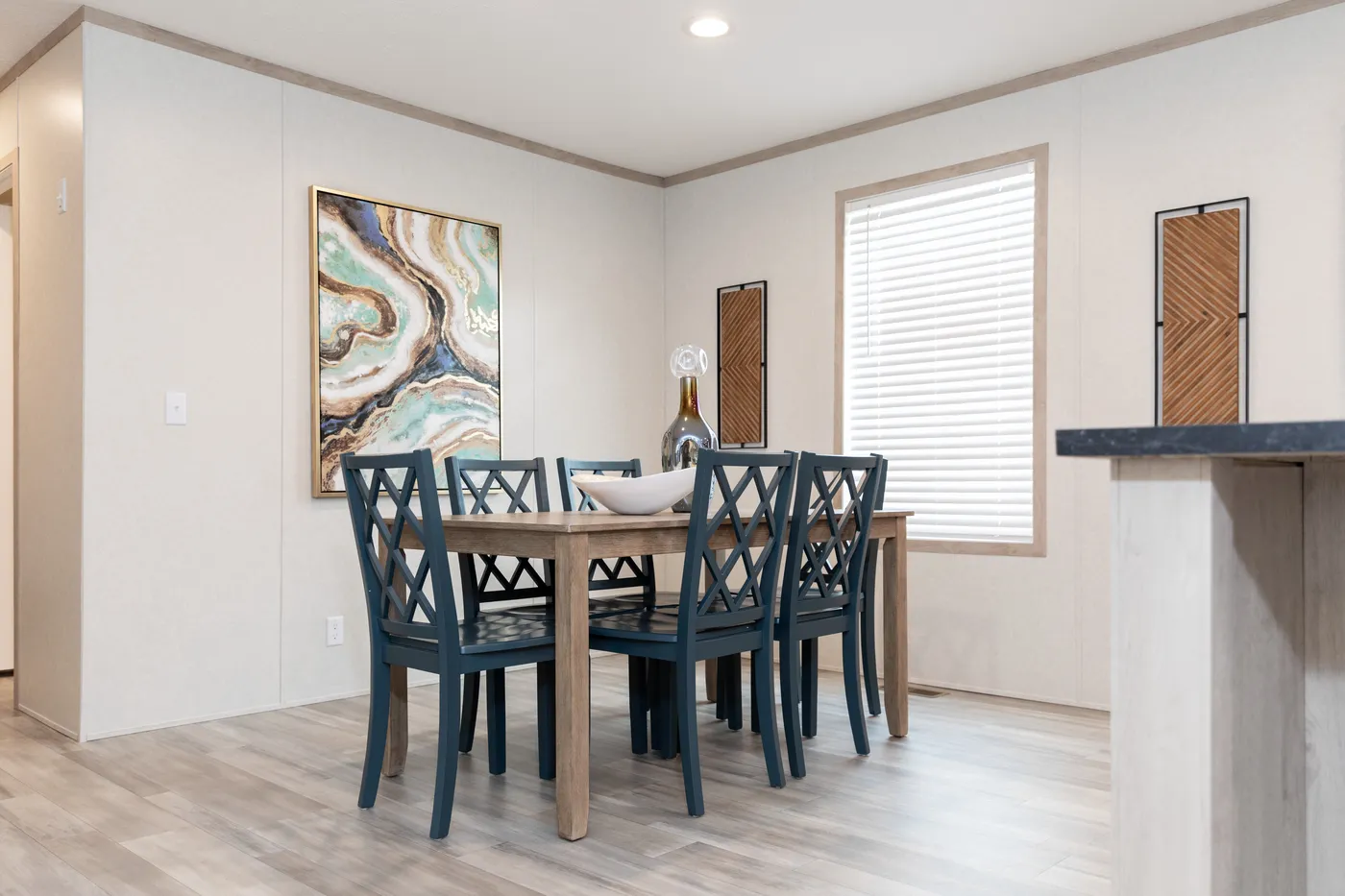 The 5628-5202 ADRENALINE Dining Room. This Manufactured Mobile Home features 3 bedrooms and 2 baths.