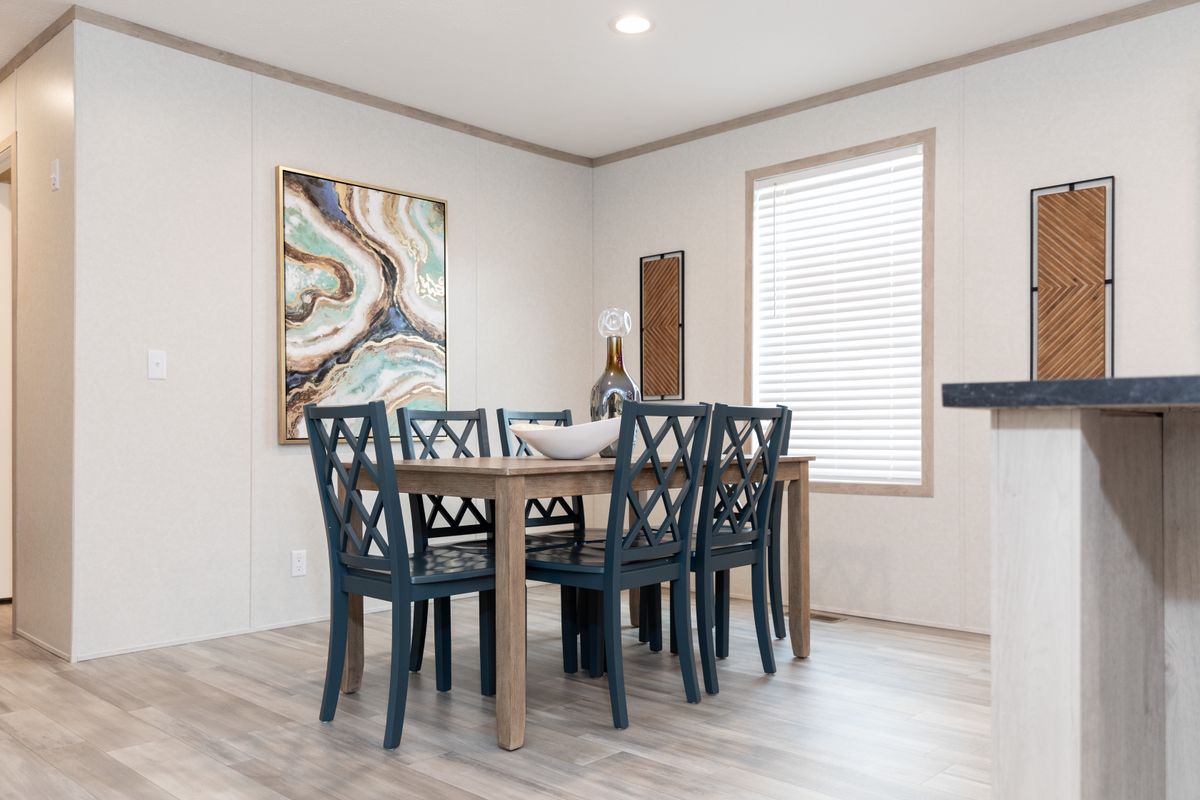 The 5628-5202 ADRENALINE Dining Room. This Manufactured Mobile Home features 3 bedrooms and 2 baths.