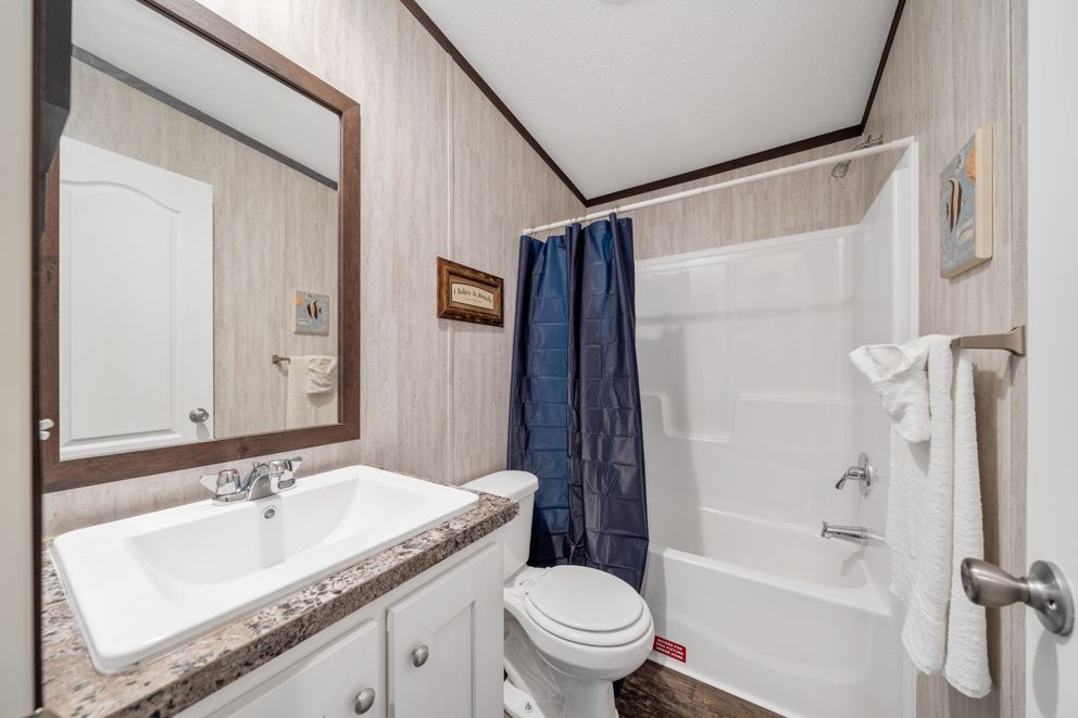 The GARNET Guest Bathroom. This Manufactured Mobile Home features 3 bedrooms and 2 baths.
