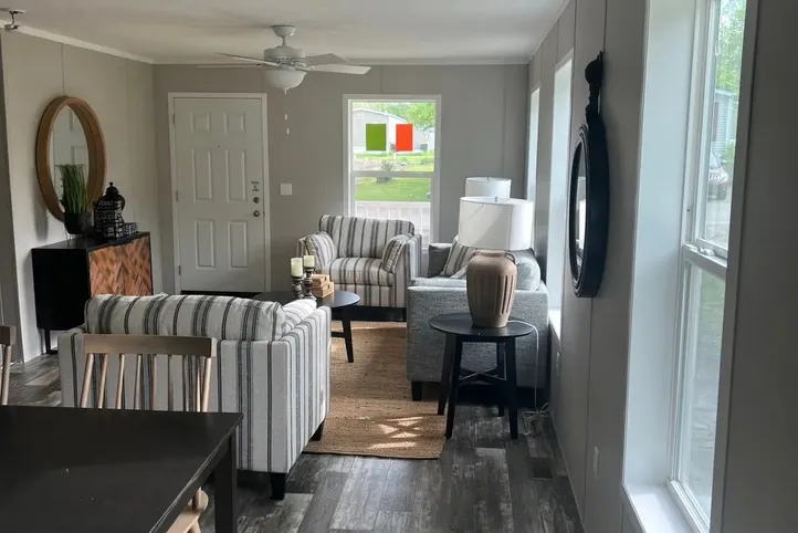 The JADE Living Room. This Manufactured Mobile Home features 2 bedrooms and 1 bath.